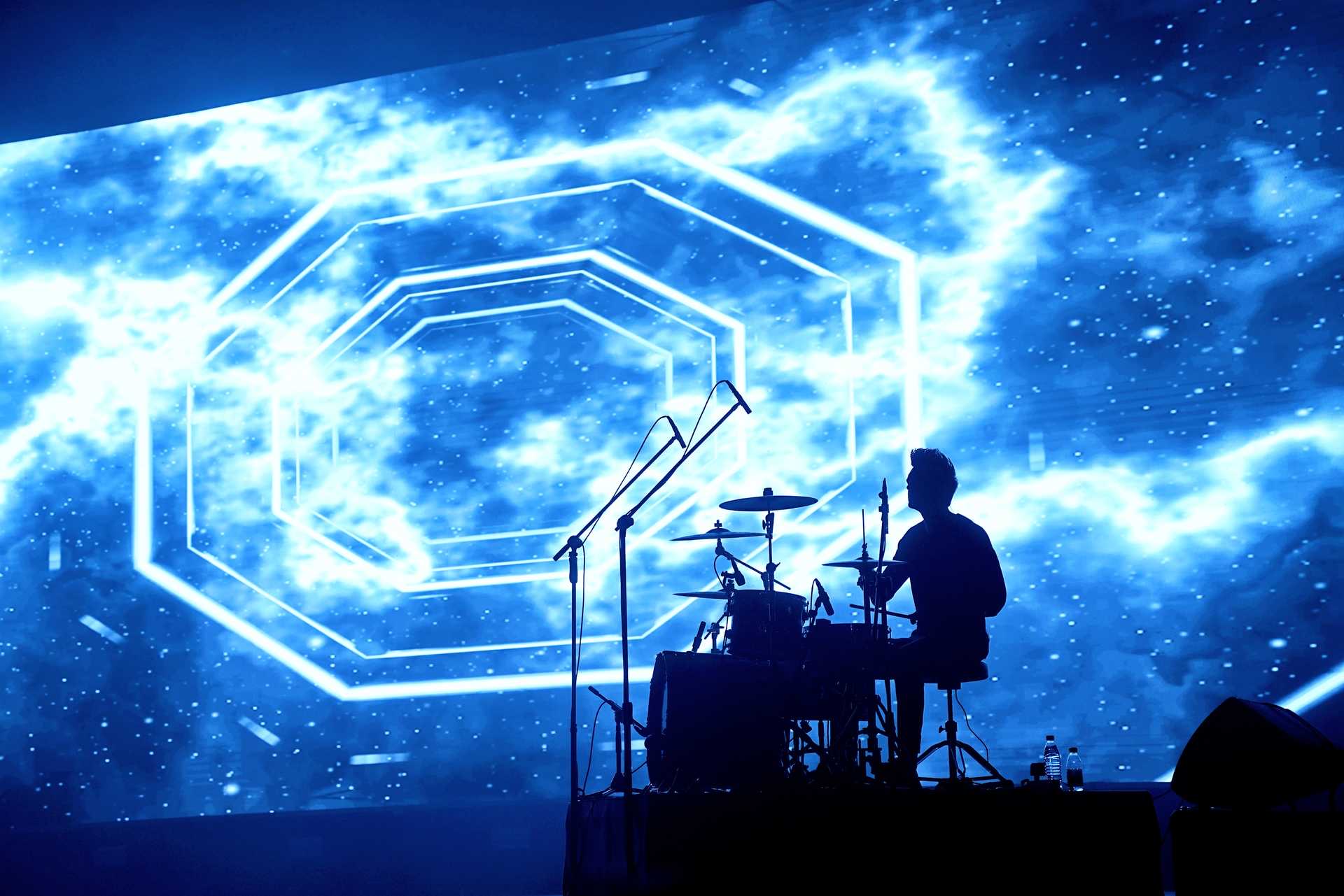Dominic performing live with the audience beyond the stage